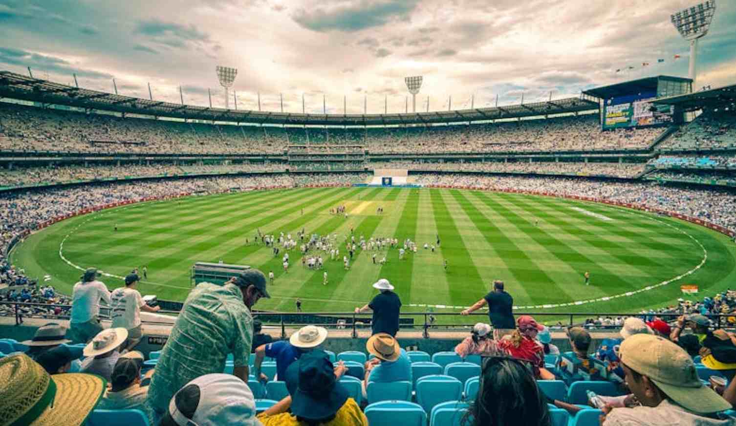 Cricket stadium during a live match with full crowd